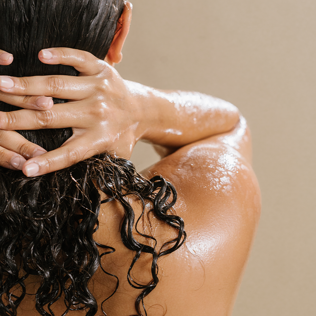 back view of woman's hair in the shower