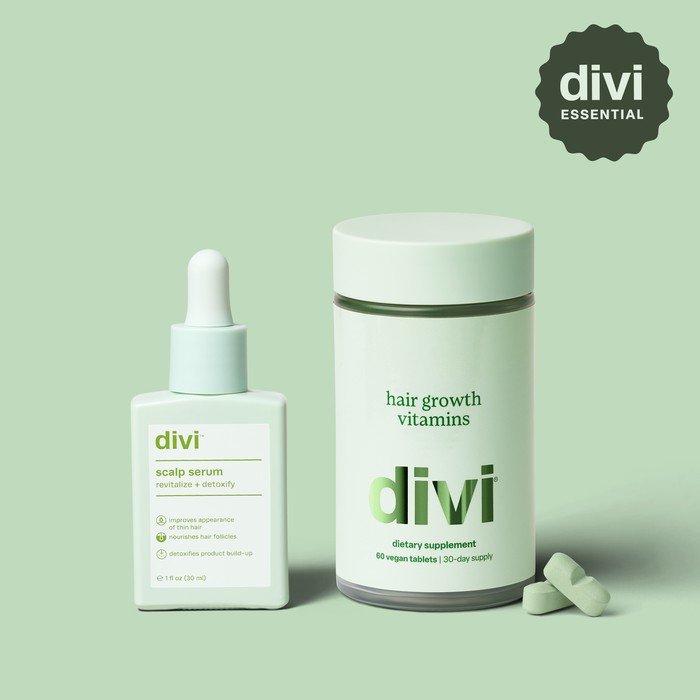 divi scalp serum, jar of hair growth vitamins, and capsules on a light green background